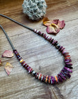 22 Inch graduated deep purple spiny and sterling silver pearls