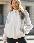 Solid Half-Zip Reverse Seam Pocketed Sweatshirt