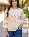 Flower Exposed Seam Wide Sleeve Top