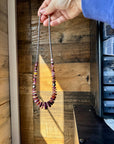 22 Inch graduated deep purple spiny and sterling silver pearls