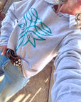 The Turquoise Boot Stitch Graphic Sweatshirt