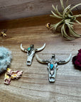 Antler longhorn with turquoise pendant