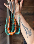 22 inch graduated orange spiny necklace with Sterling silver pearls