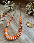 22 inch graduated orange spiny necklace with Sterling silver pearls