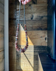 22 Inch graduated necklace more purple and orange spiny and sterling silver pearls