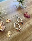 Orange spiny dangle earrings with turquoise