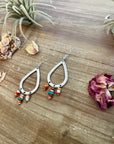 Orange spiny dangle earrings with turquoise