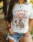 Ain't My First Rodeo Cowgirl Graphic Tee