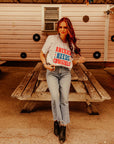 America Needs Cowgirls Graphic Tee