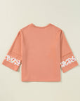 Flower Exposed Seam Wide Sleeve Top