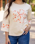 Flower Exposed Seam Wide Sleeve Top