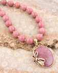 Gifted Pink Rhodonite Gold Bow Beaded Pendant Necklace
