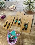 Green turquoise dangle earrings with brown shell