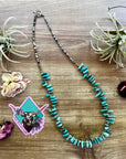 22 inch long real turquoise and shell teardrop shape blue side
