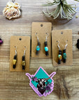 Green turquoise dangle earrings with brown shell