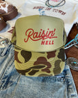 Raisin' Hell Green Camo Trucker Hat