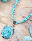 Carved Blue Turquoise and Sterling Silver Pendant