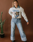Cowgirl Killers V-Neck Raw Hem Graphic Sweatshirt