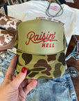 Raisin' Hell Green Camo Trucker Hat